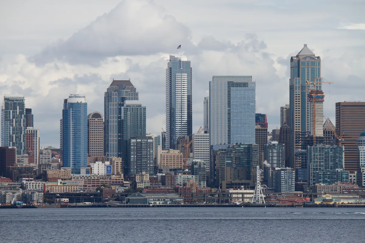 CascadiaSTR management fees, Cluster of Seattle high-rises rising above the waterfront