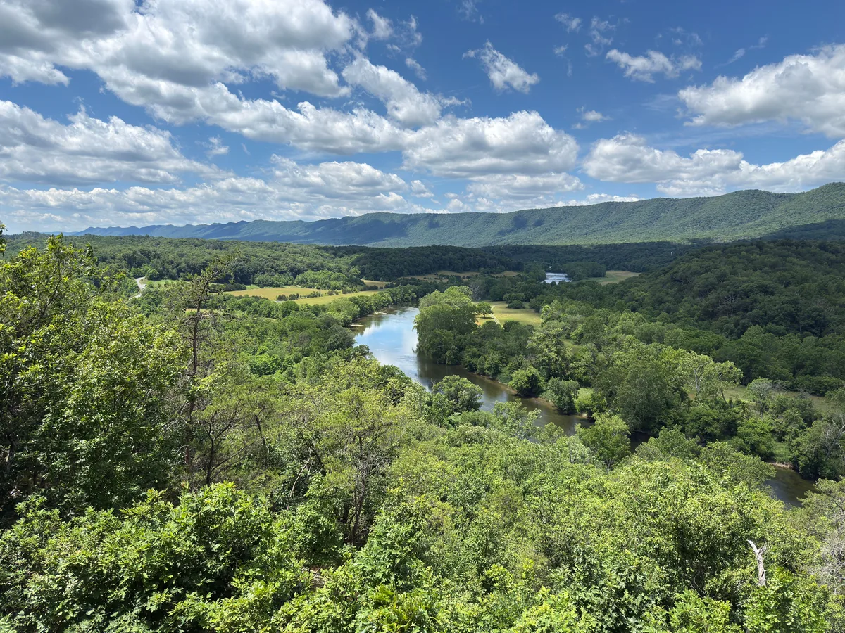 All Belong Co alternatives for Airbnb owners, River winding through a wooded Virginia valley