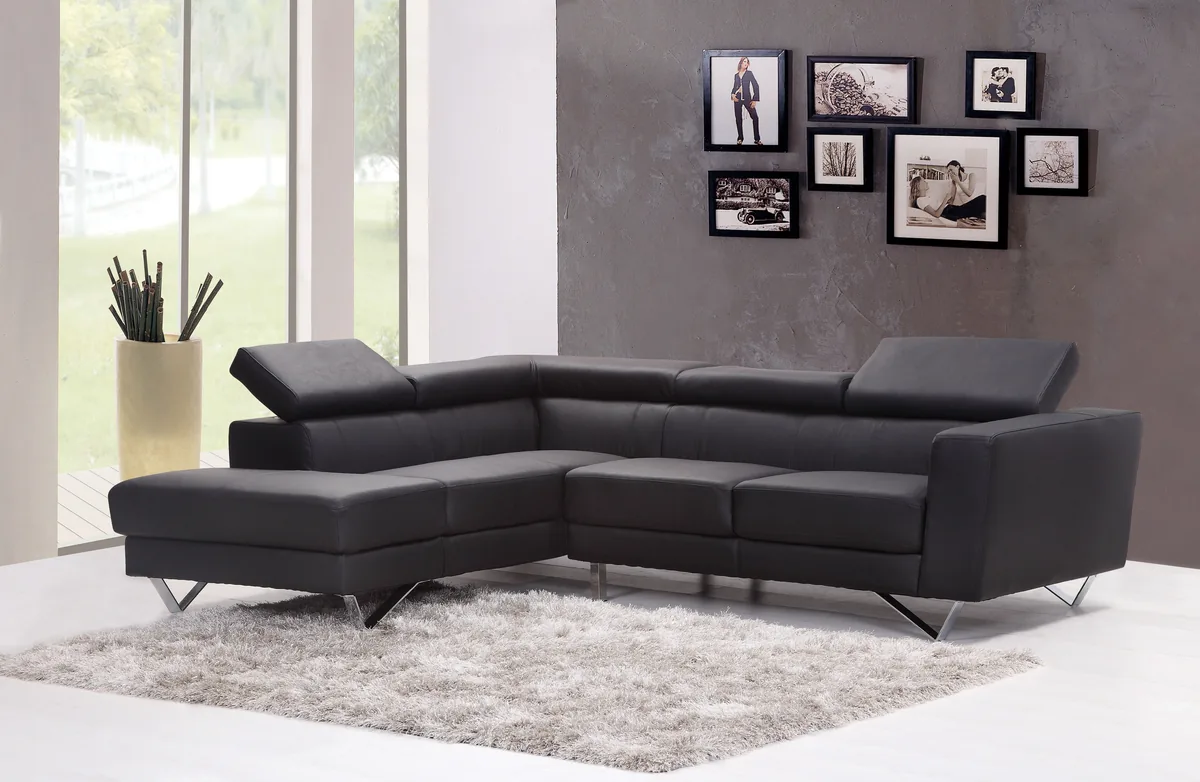 SEA Getaways management fees, Living room with a leather corner sofa in a rental property