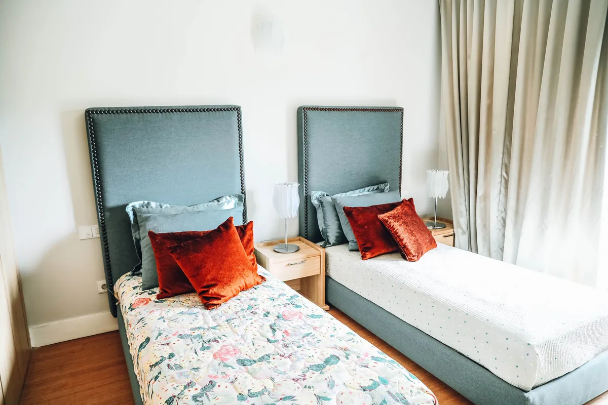 Meredith Lodging alternatives for Airbnb owners, Twin beds made up for guests in a rental property