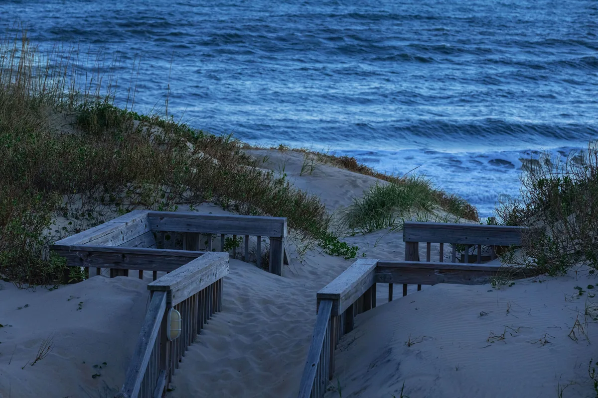 Twiddy & Company alternatives for Airbnb owners, Timber steps crossing a dune down to the beach