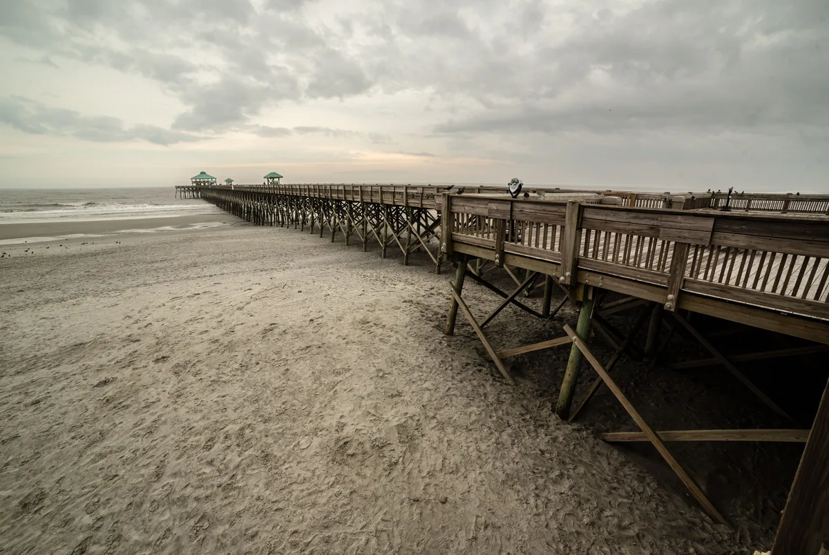 StayDuvet alternatives for Airbnb owners, Timber pier running out over an empty beach