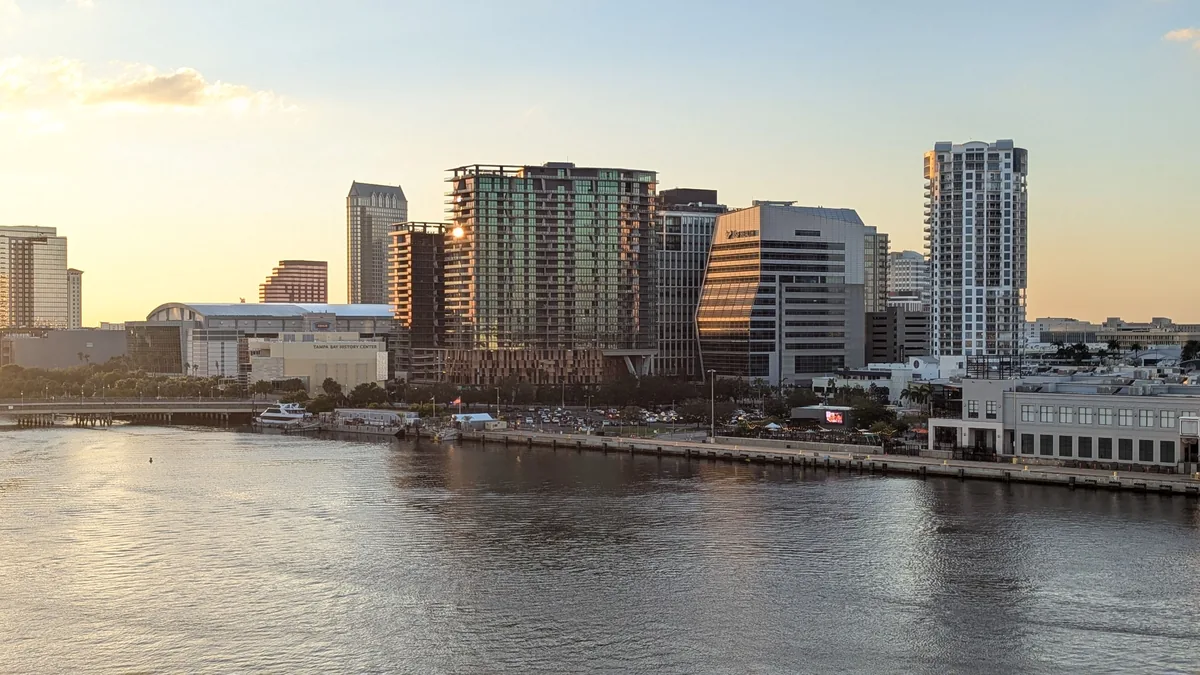 Tampa Bay Stays management fees, Tampa skyline at sunset seen across the water