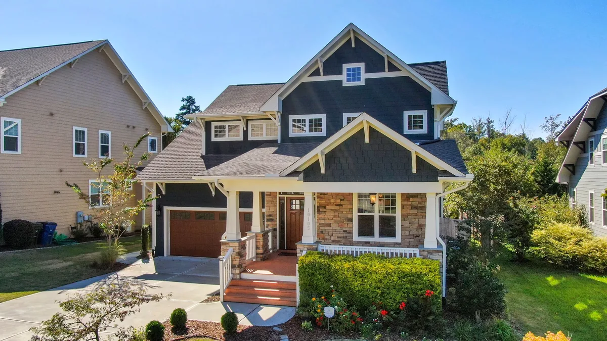 Misfit Homes alternatives for Airbnb owners, Craftsman house with gabled dormers on a leafy street