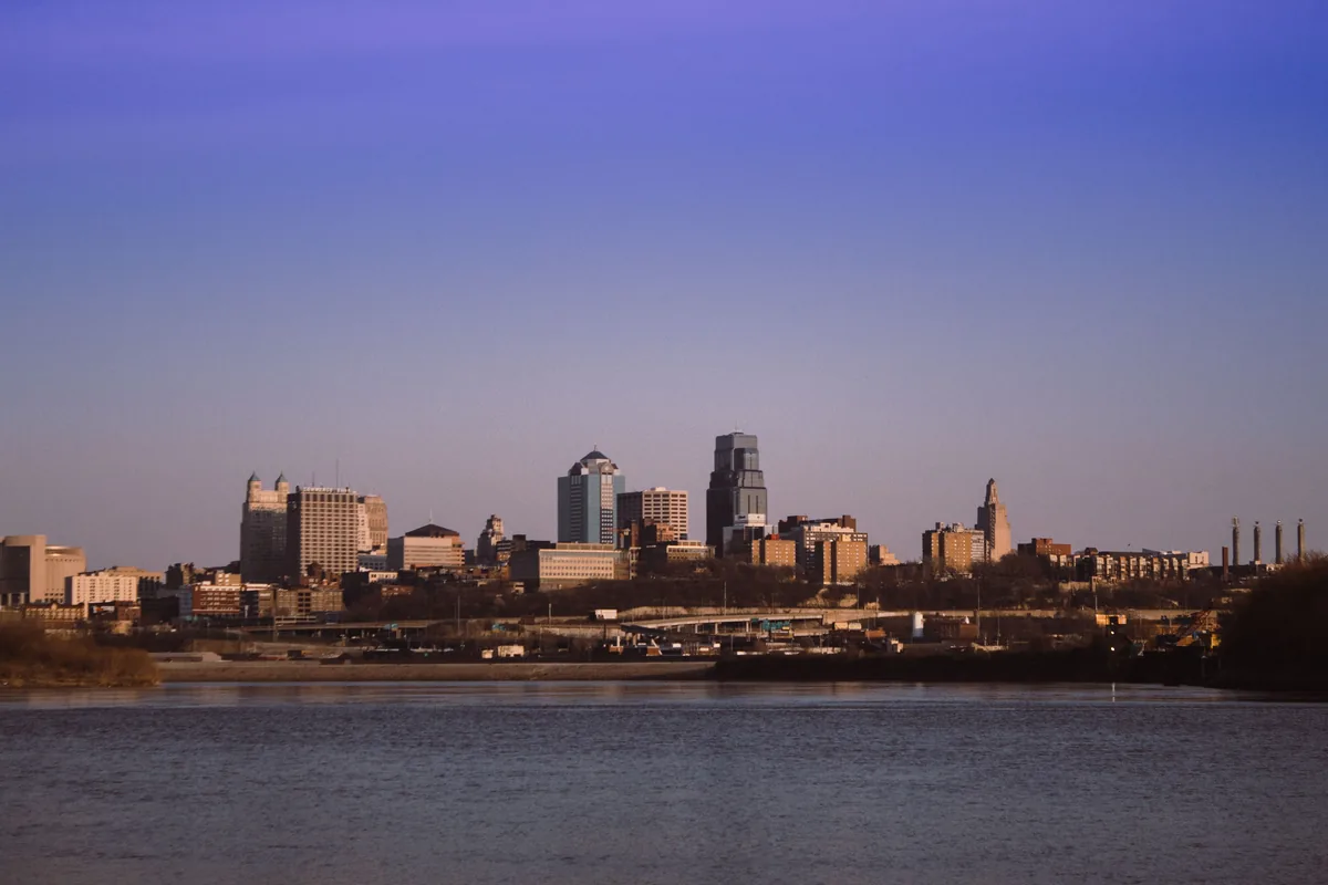 BearBnB management fees, Kansas City downtown at dusk across the river