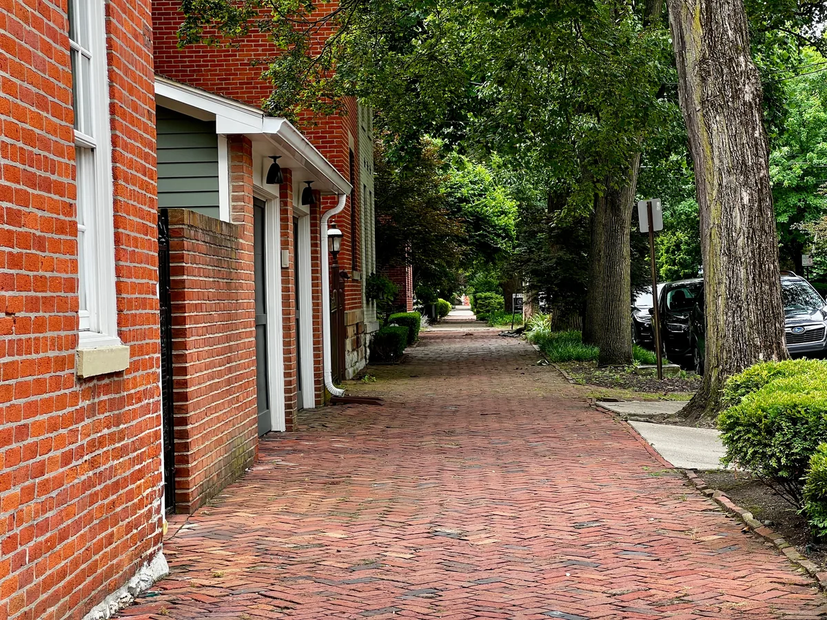 GH Hospitality management fees, Brick-paved street lined with brick houses and mature trees