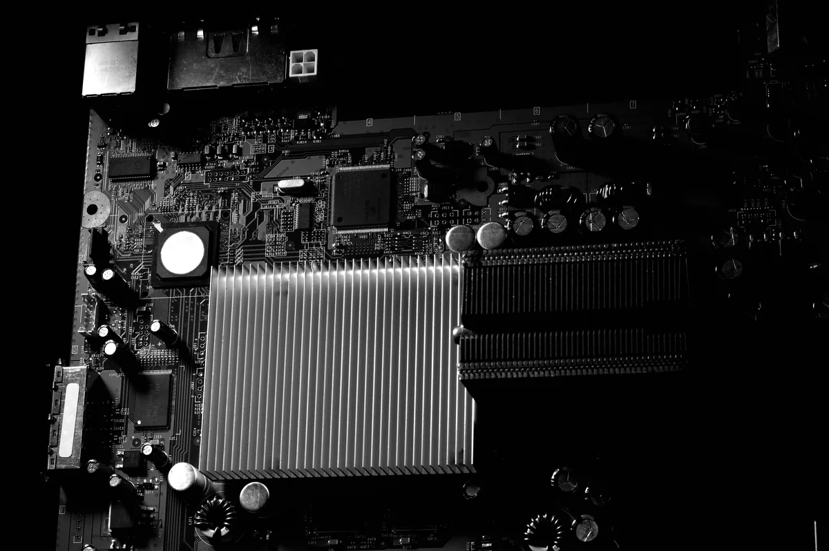 DOSbnb alternatives for Airbnb owners, Computer motherboard with its heatsink in black and white