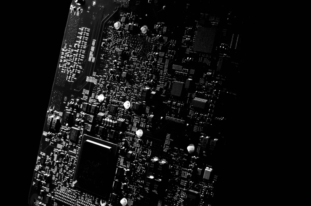 Boring Host management fees, Close-up of circuit board tracks in black and white