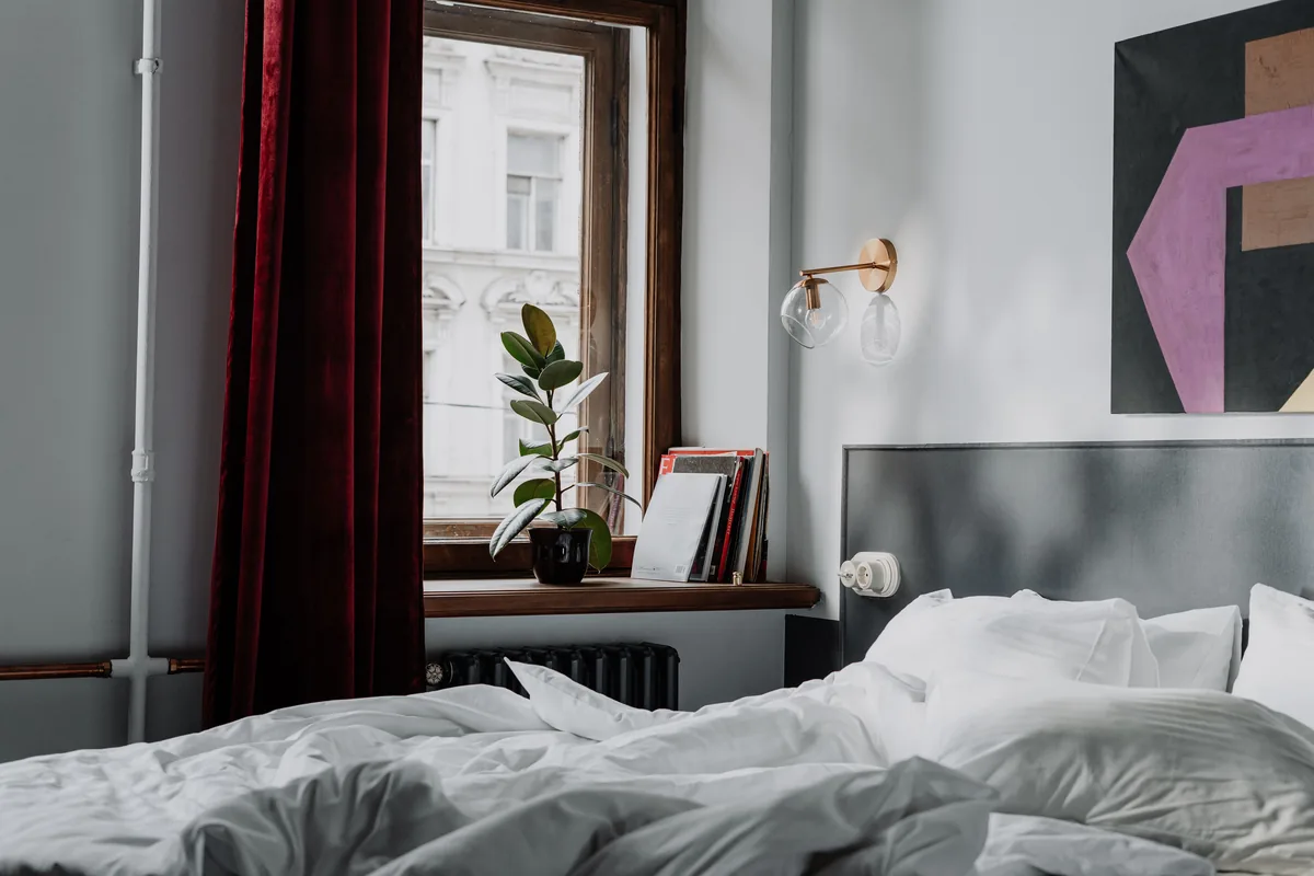 Bedroom with window and radiator — What Palo Alto Property Owners Should Know About the Airbnb Vacation Rental Market