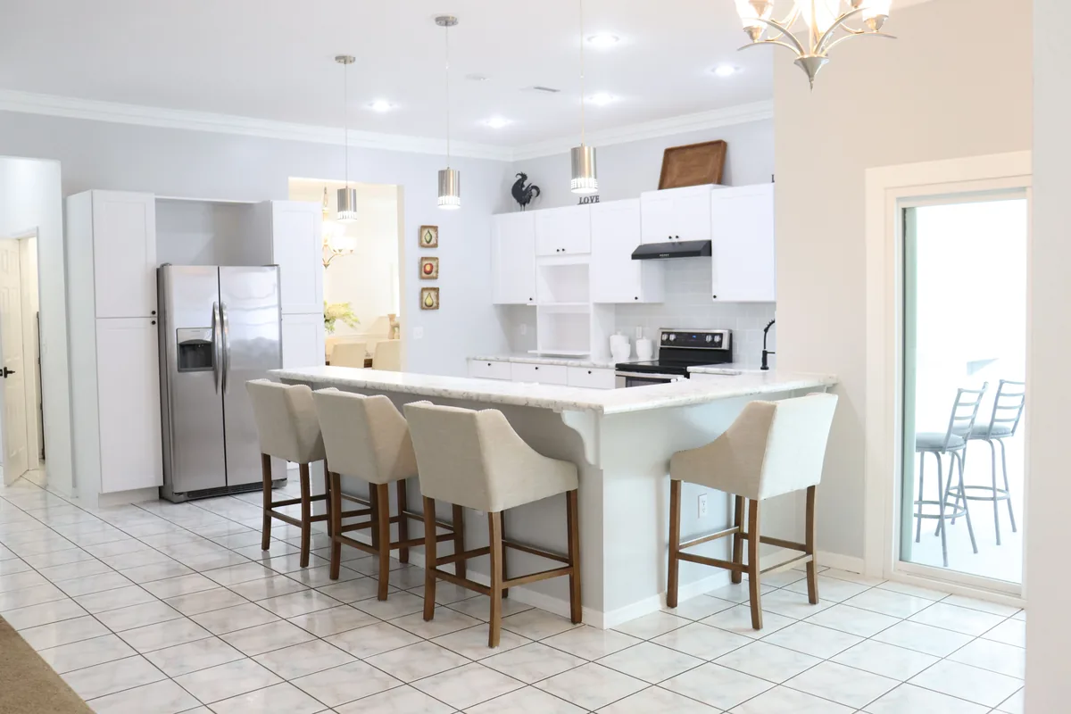 Kitchen island with stools, bright — Top 15 Short-term Rental Platforms for Easy Booking Solutions