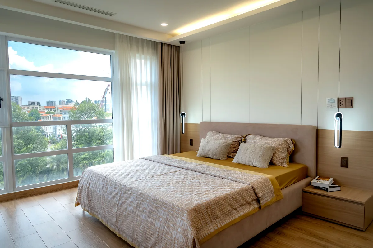 Bedroom opening onto a balcony — Thinking Of Your Next Real Estate Investment? We Got You!