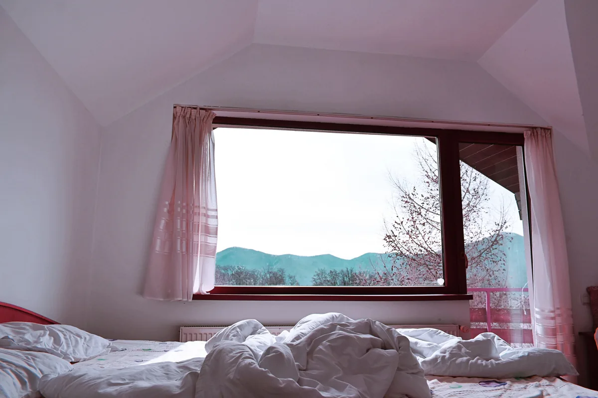 Attic bedroom with a valley view — Vrbo Host Fees: Comprehensive Guide to Maximize Your Rental Income