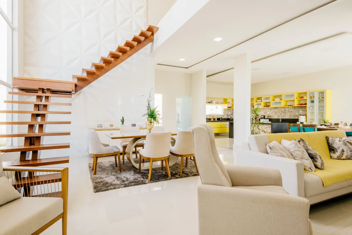 Open plan with staircase, dining and living — Airbnb Cleaning Fee: How Much to Charge and What's the Average
