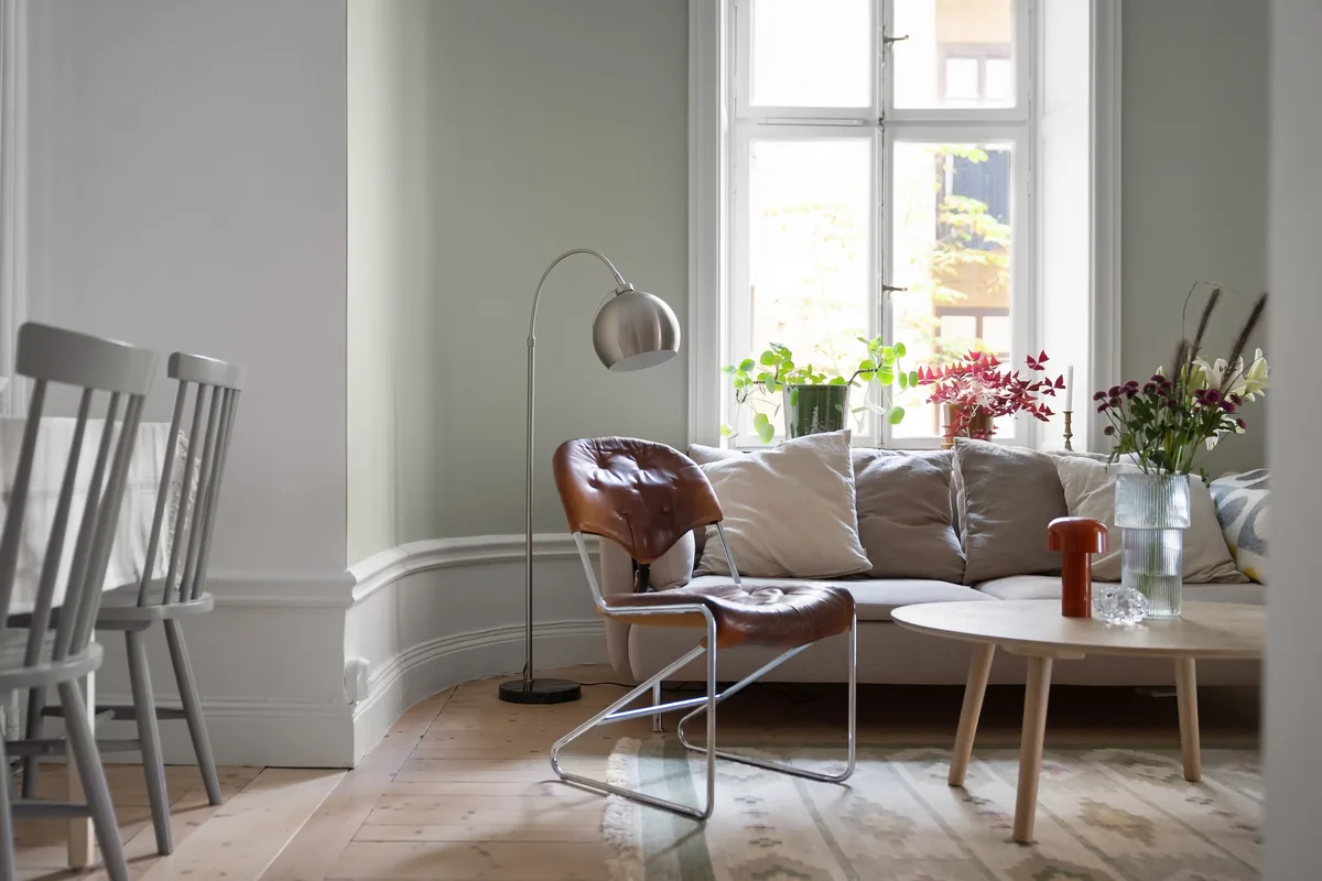 Bright living room with armchair and sofa — Airbnb Channel Manager: How to Sync Your Listings Across Platforms
