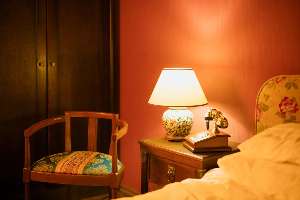 Bedroom corner, orange wall — Airbnb Guest Screening: How to Vet Guests and Protect Your Property