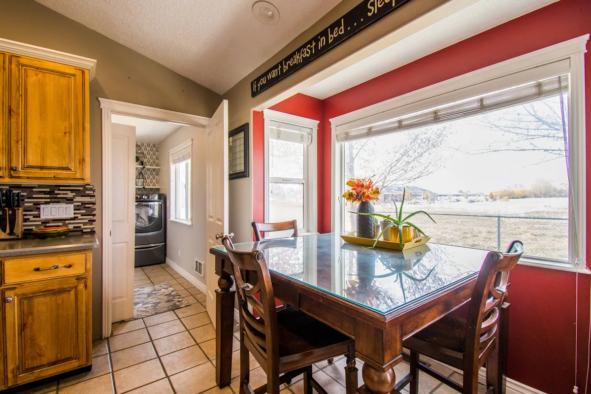 Dining area beside the kitchen, red wall — Airbnb Travel Insurance: Is It Worth It for Guests and Hosts?