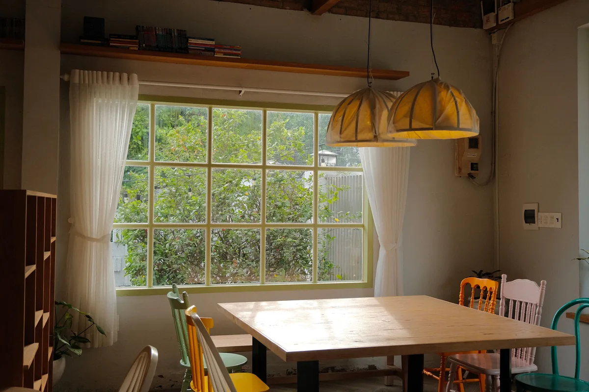 Dining table under a window — Airbnb Travel Insurance: Is It Worth It for Guests and Hosts?
