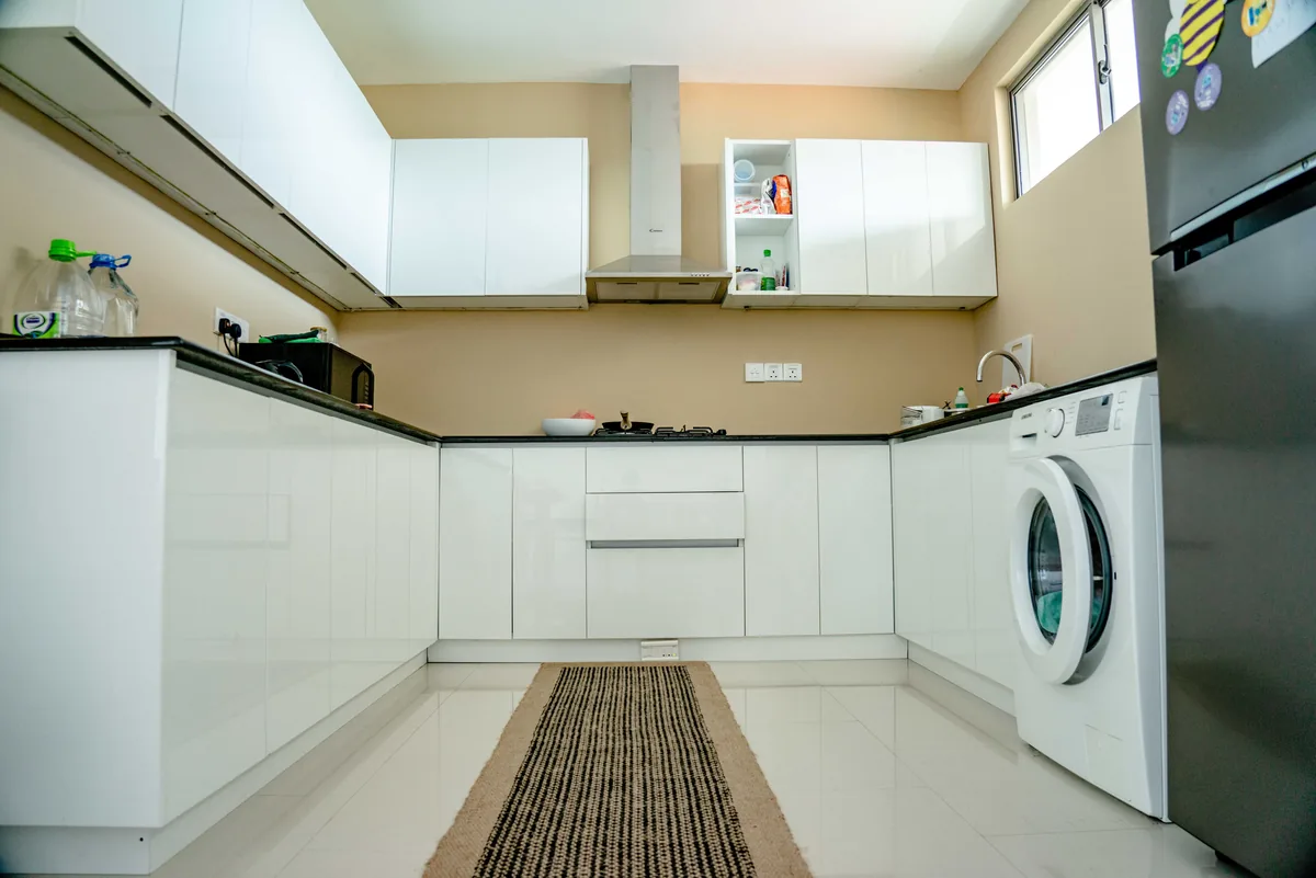 Plain kitchen with a washing machine — Unlocking Chandler's Rental Management Potential