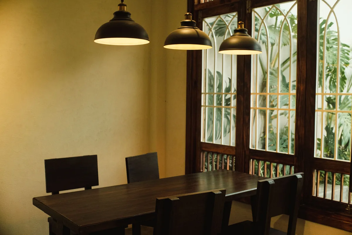 Dining table under pendant lights — Airbnb Management Vancouver BC: Principal Residence Rules and 5 Companies
