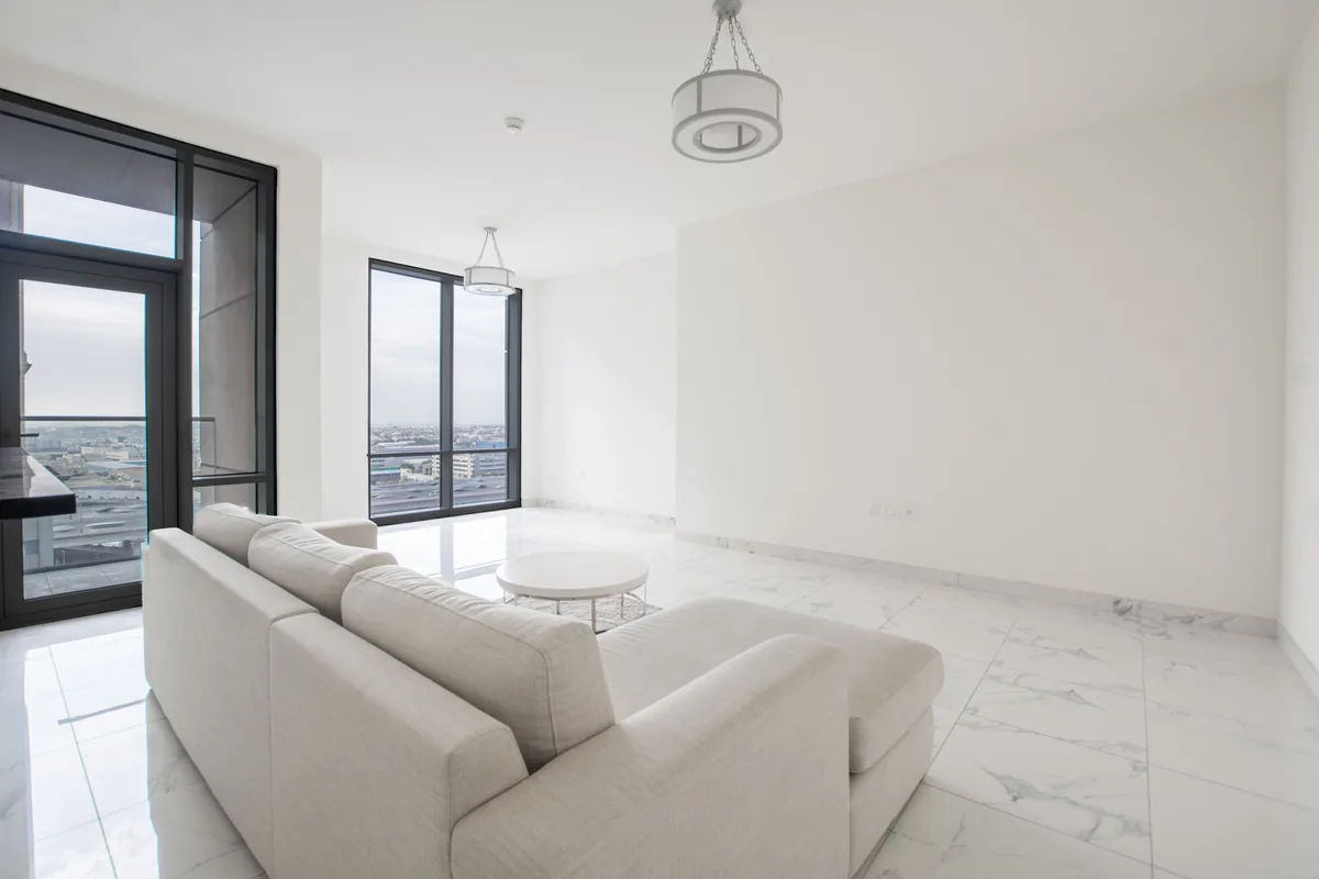 White living room, marble floor — Airbnb Management Fee: What Property Managers Charge in 2026