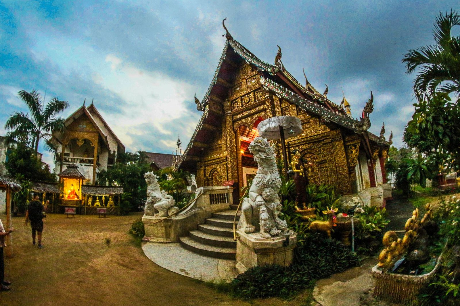 A northern Thai temple hall with naga guardians at its steps