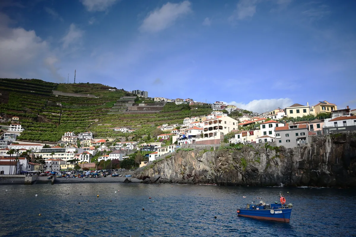 GuestReady management fees, Terraced Madeira village above a harbour