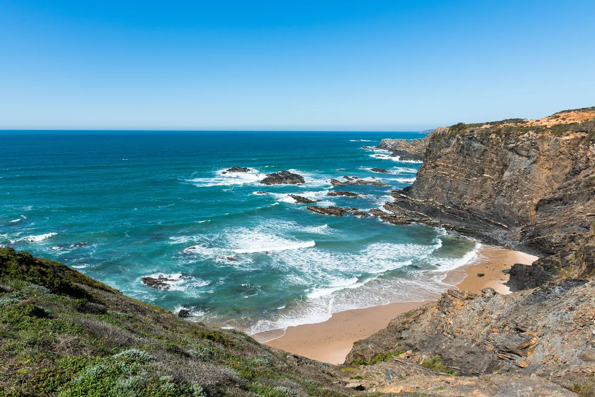 Home With A View alternatives Portugal, Rugged Alentejo coastline with turquoise water
