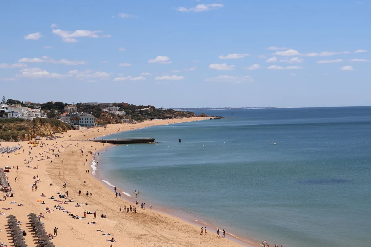 Amarante Villas management fees, Broad Algarve beach curving to a headland