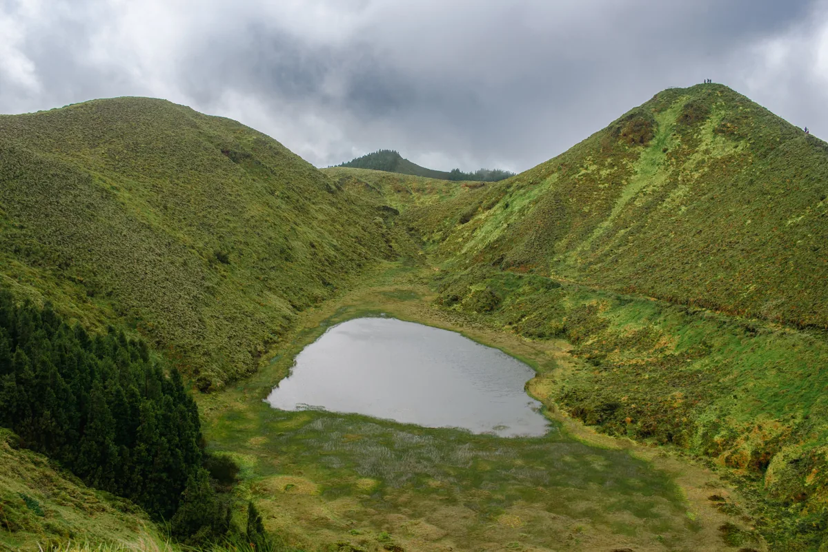 Green Vacations alternatives Portugal, Crater lake between green peaks on Sao Miguel