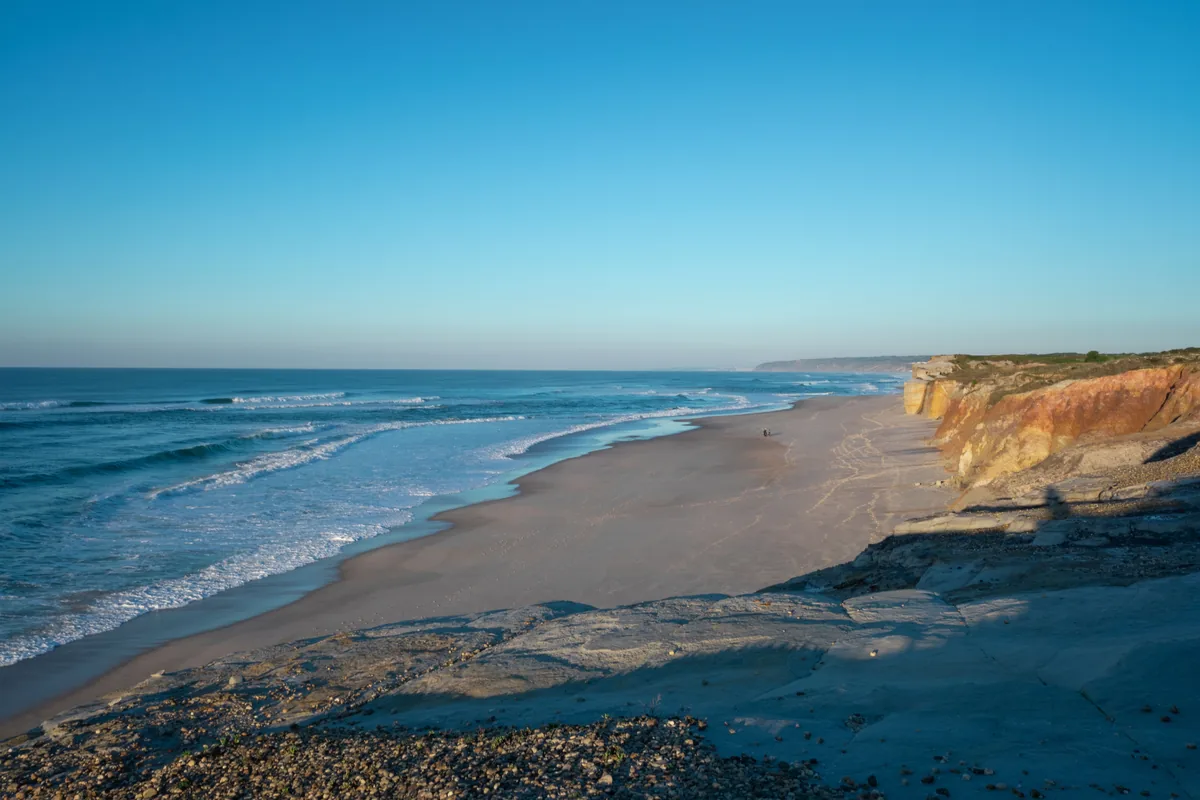 A long Atlantic beach below low cliffs on the Silver Coast