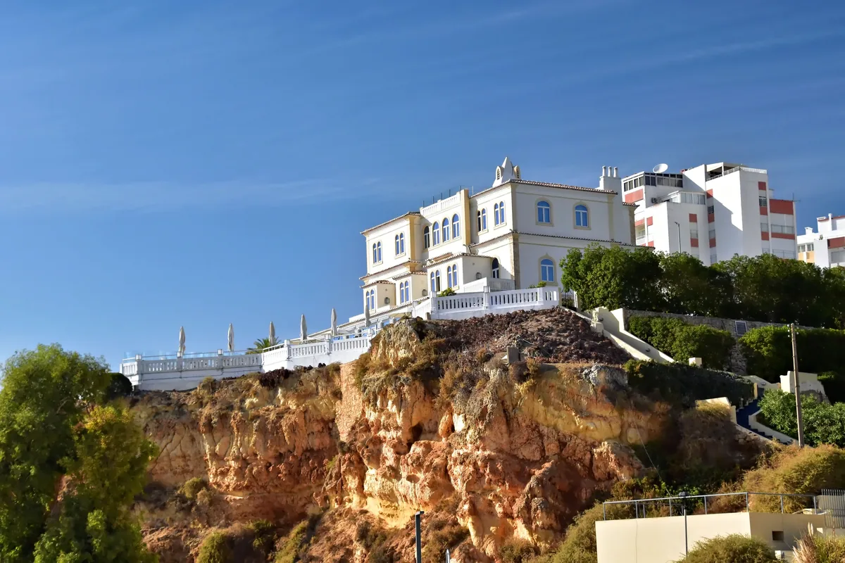 A white villa on a rocky Algarve clifftop