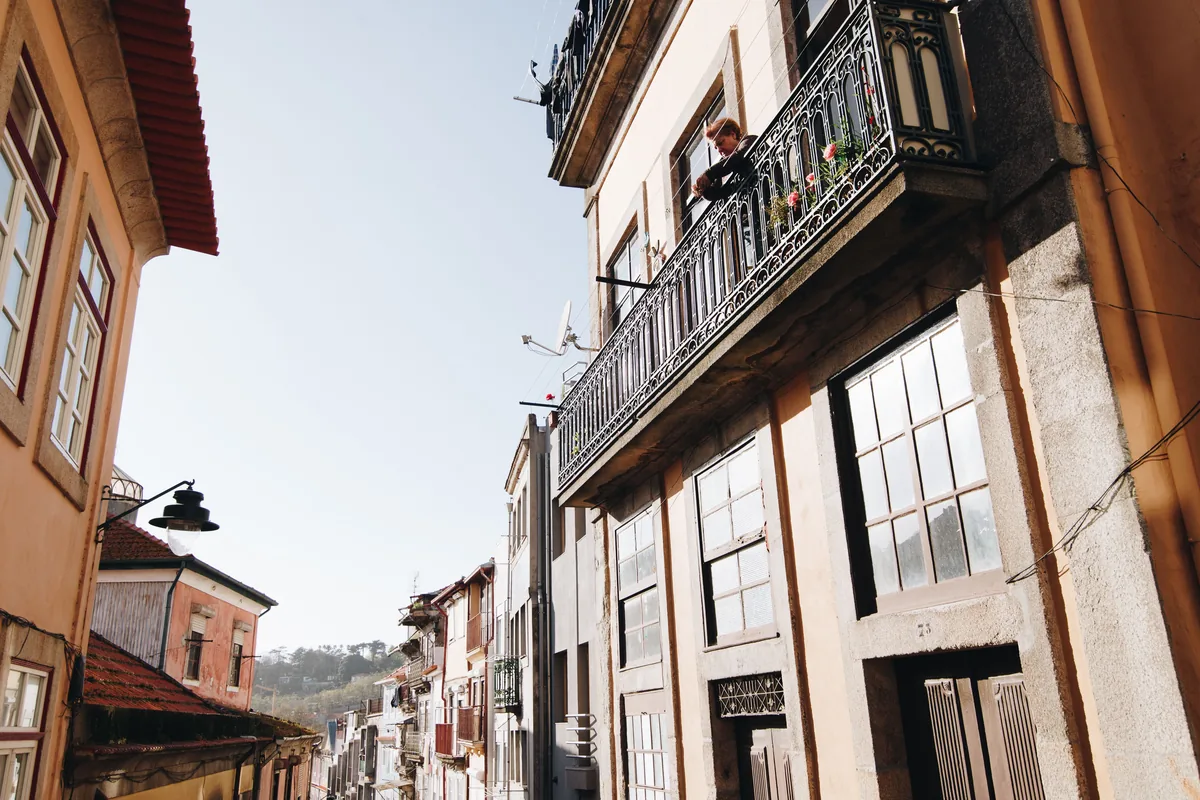 Balconies and traditional facades on a steep Portuguese street