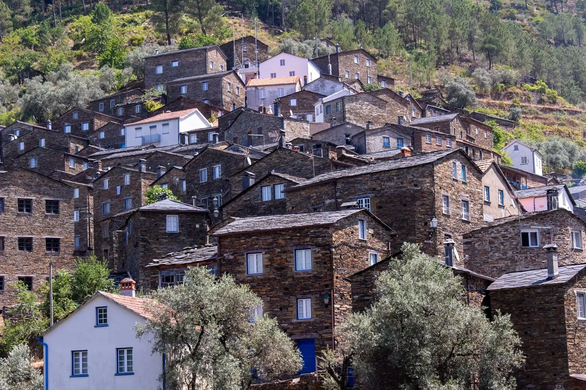 Stone and schist houses packed on a hillside in central Portugal