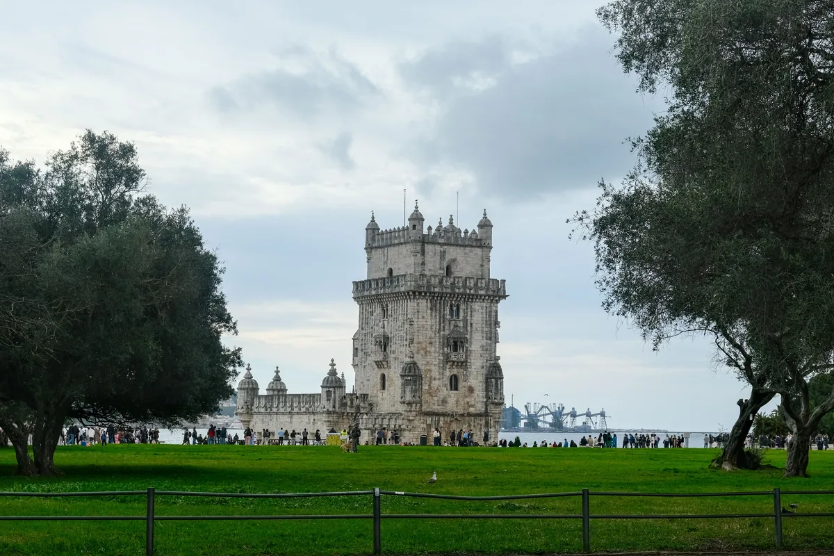 The Torre de Belem seen across parkland in Lisbon