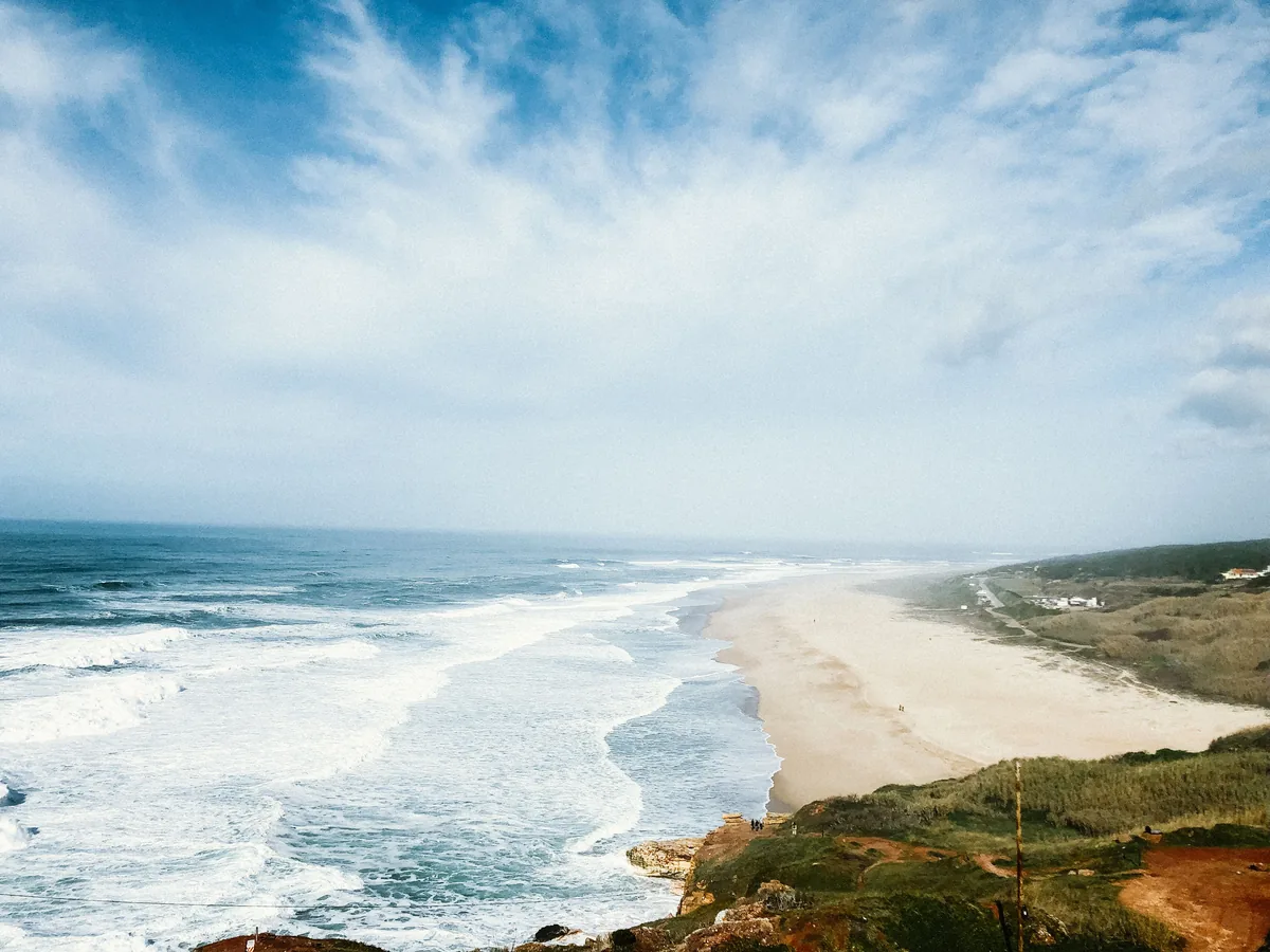 The long sweep of Nazare beach and its headland