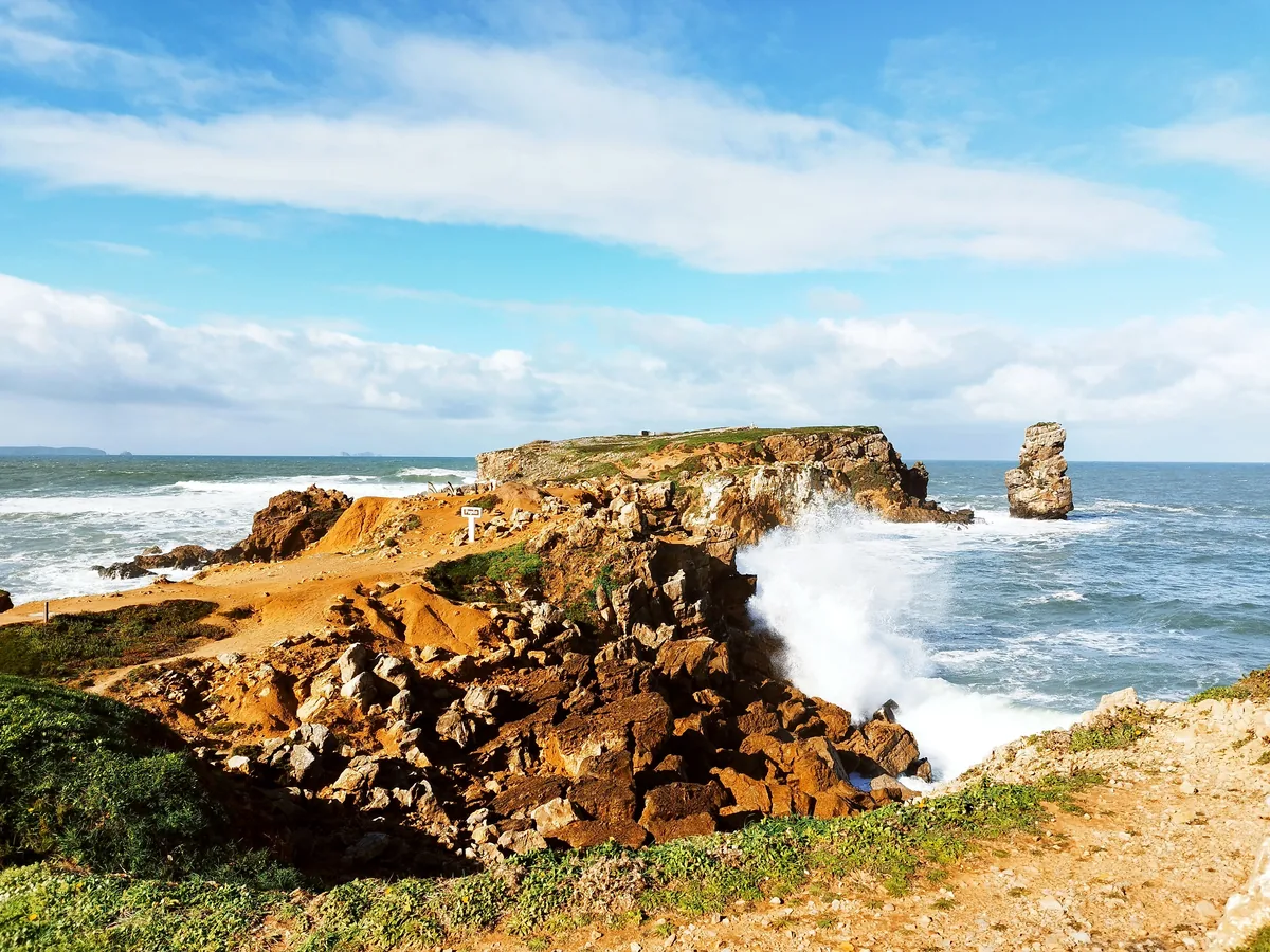 Waves breaking against the Papoa headland at Peniche