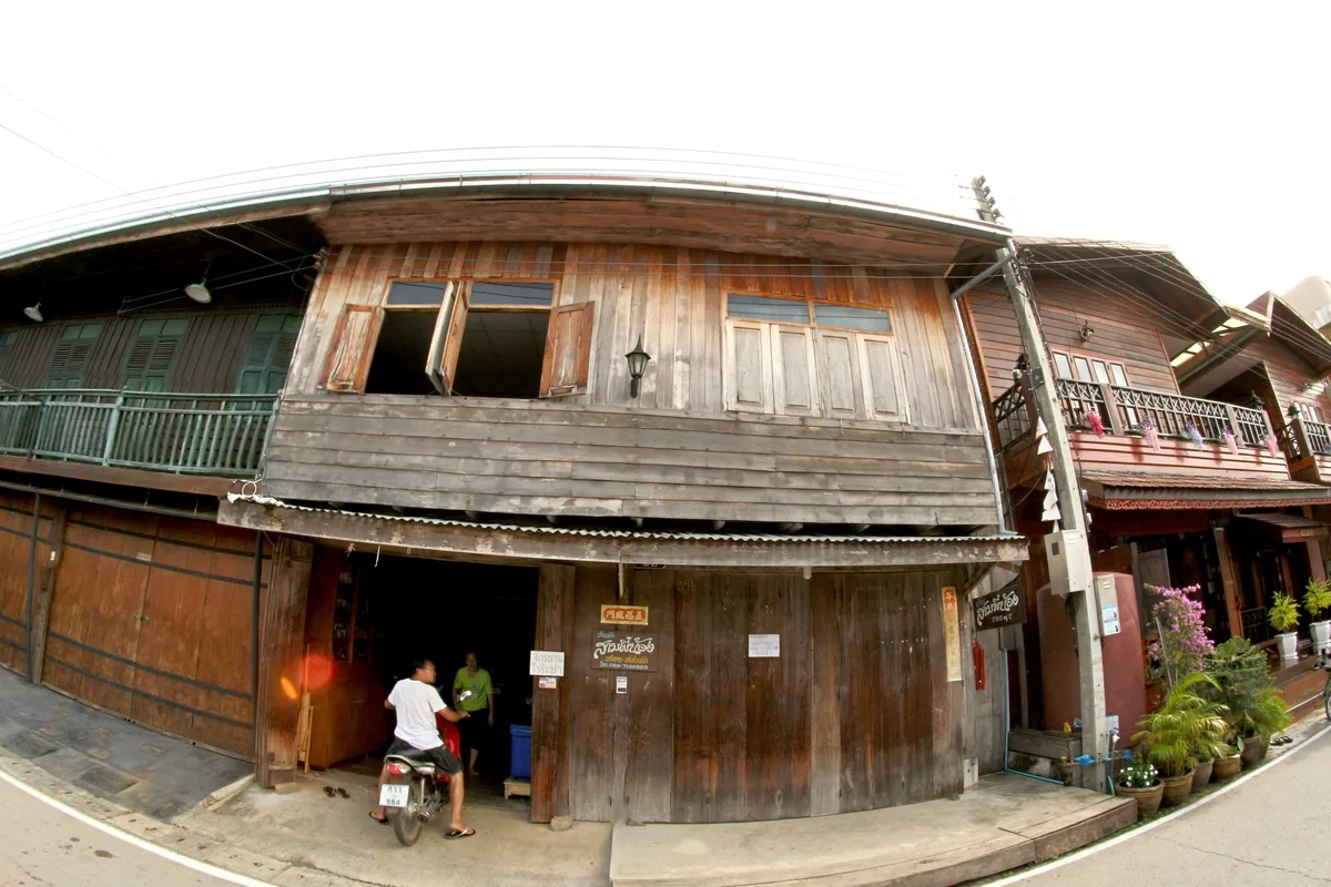 Old wooden shophouses on a Thai island street