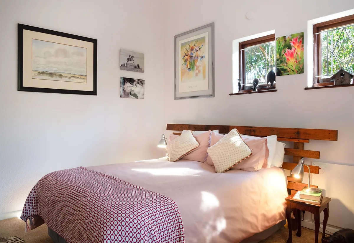 Bedroom made up with white linen