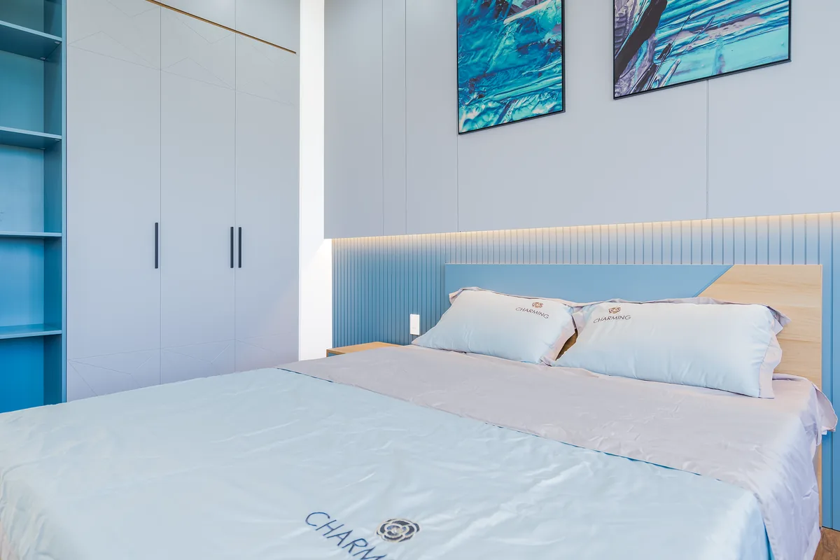 Bedroom made up with white linen