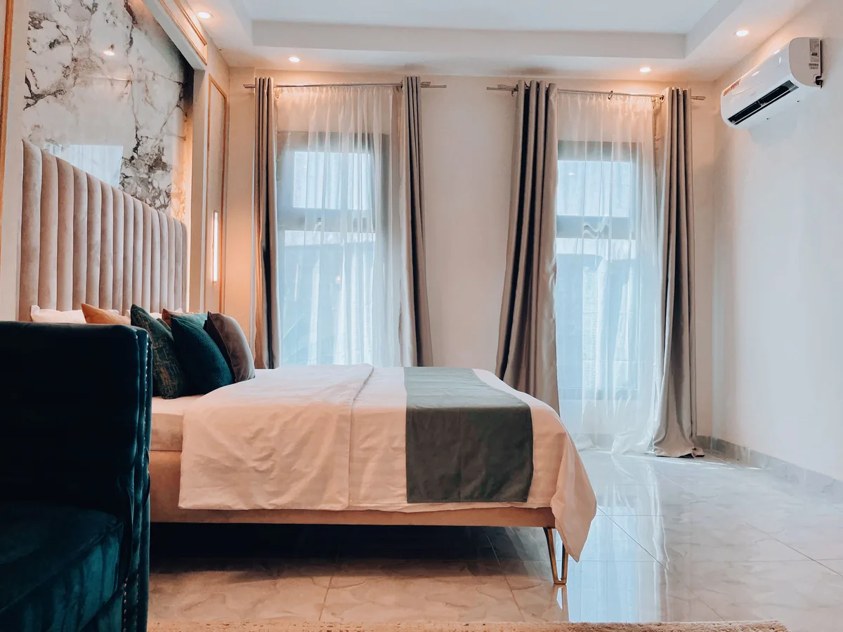 Bedroom made up with white linen
