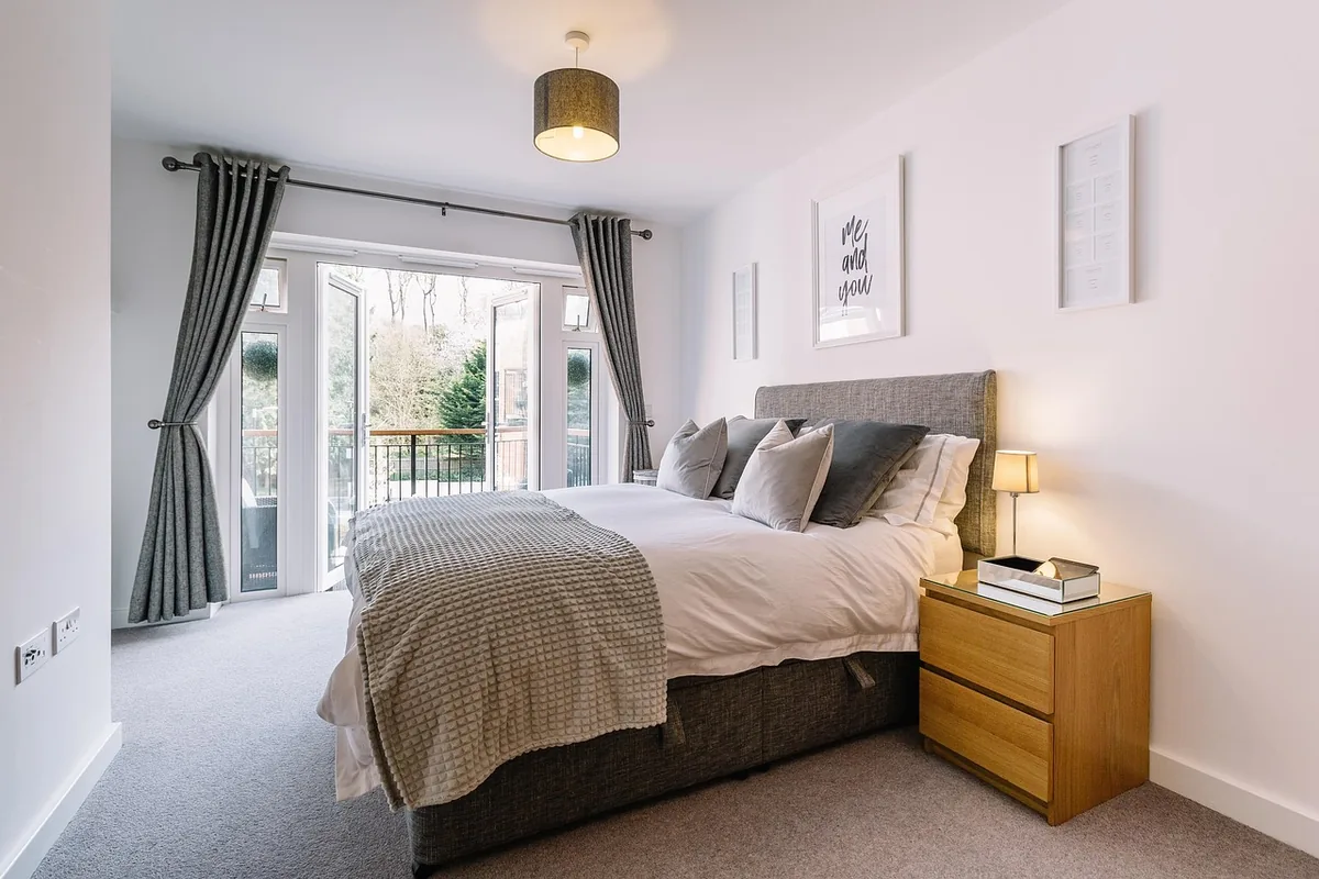 Bedroom made up with white linen