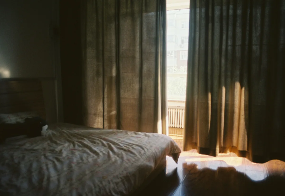 Bedroom with a large window