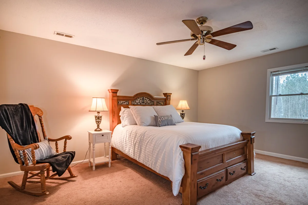 Bedroom made up with white linen