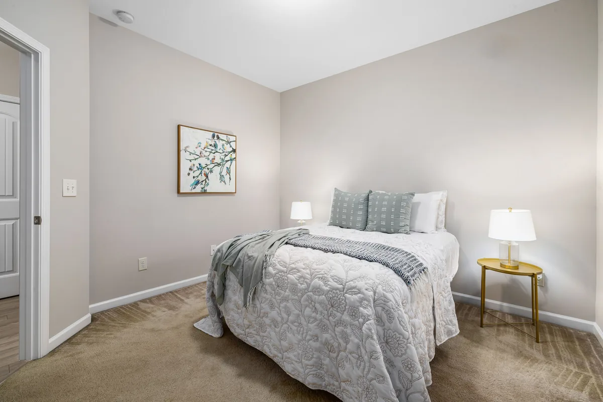 Bedroom made up with white linen