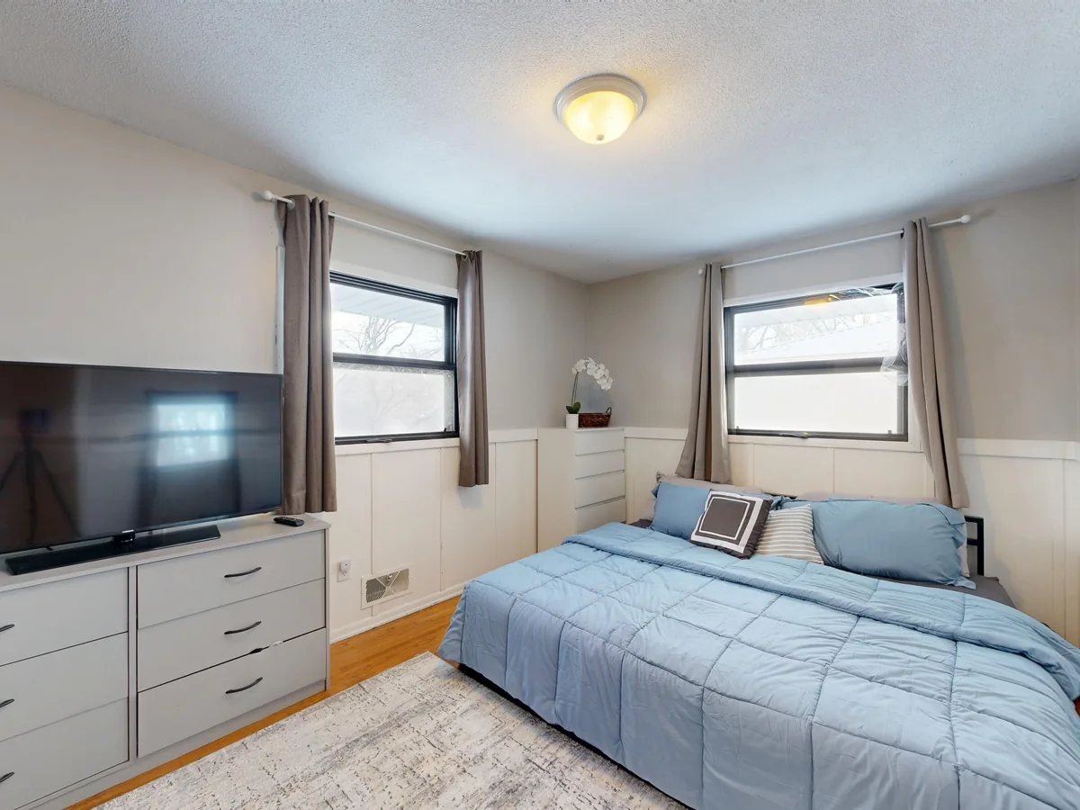 Bedroom made up with white linen
