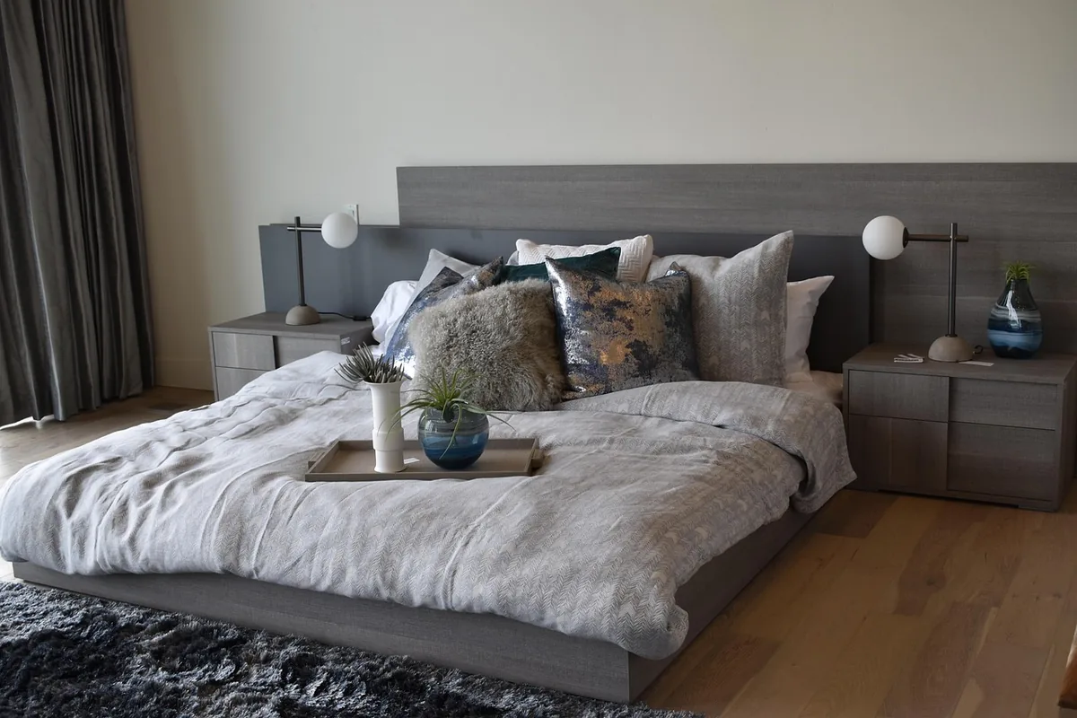 Bedroom made up with white linen