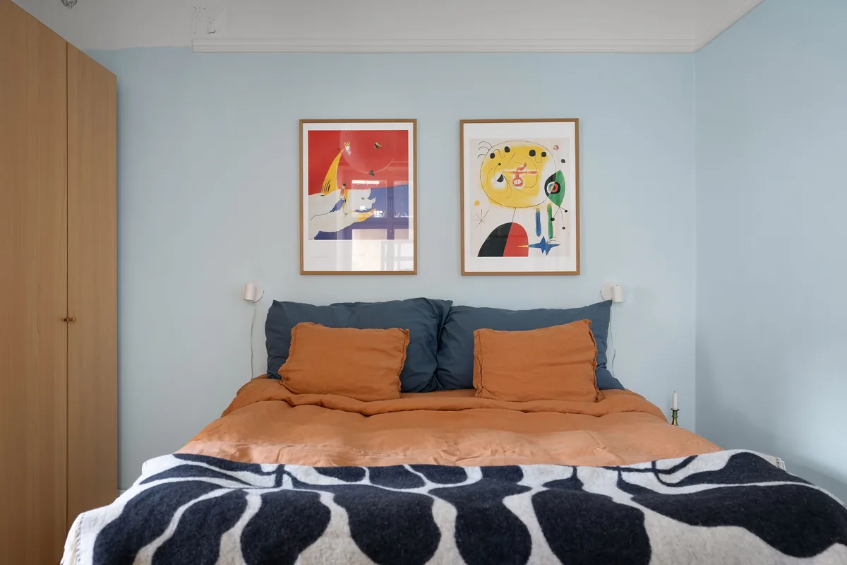 Bedroom made up with white linen