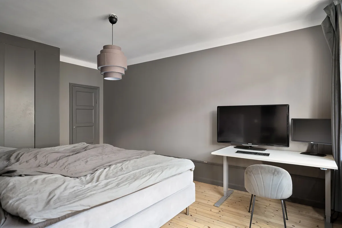 Bedroom made up with white linen