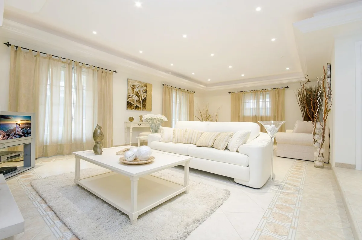 Bedroom made up with white linen