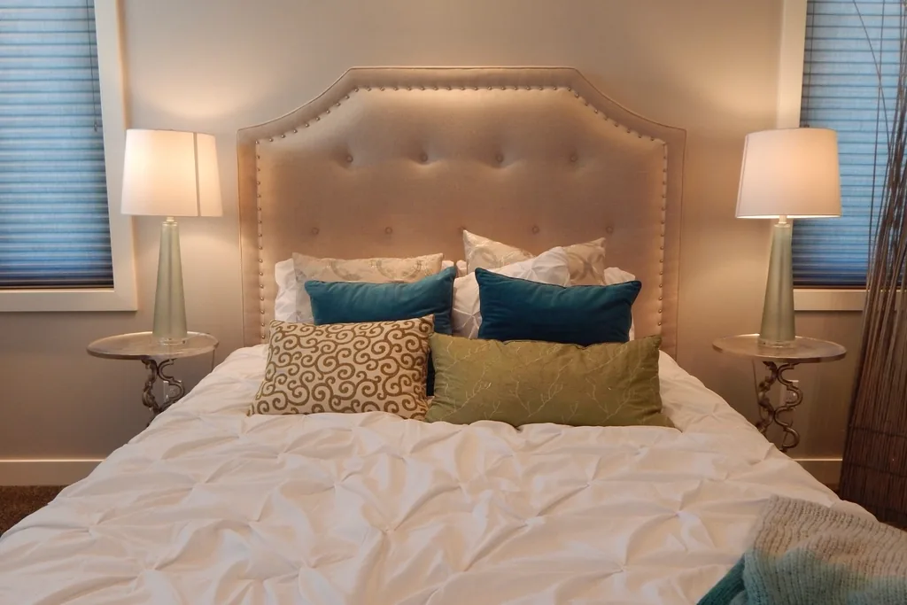 Bedroom made up with white linen